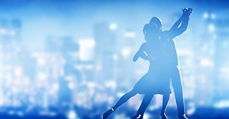 Romantic couple dance. Elegant classic pose. City nightlife background